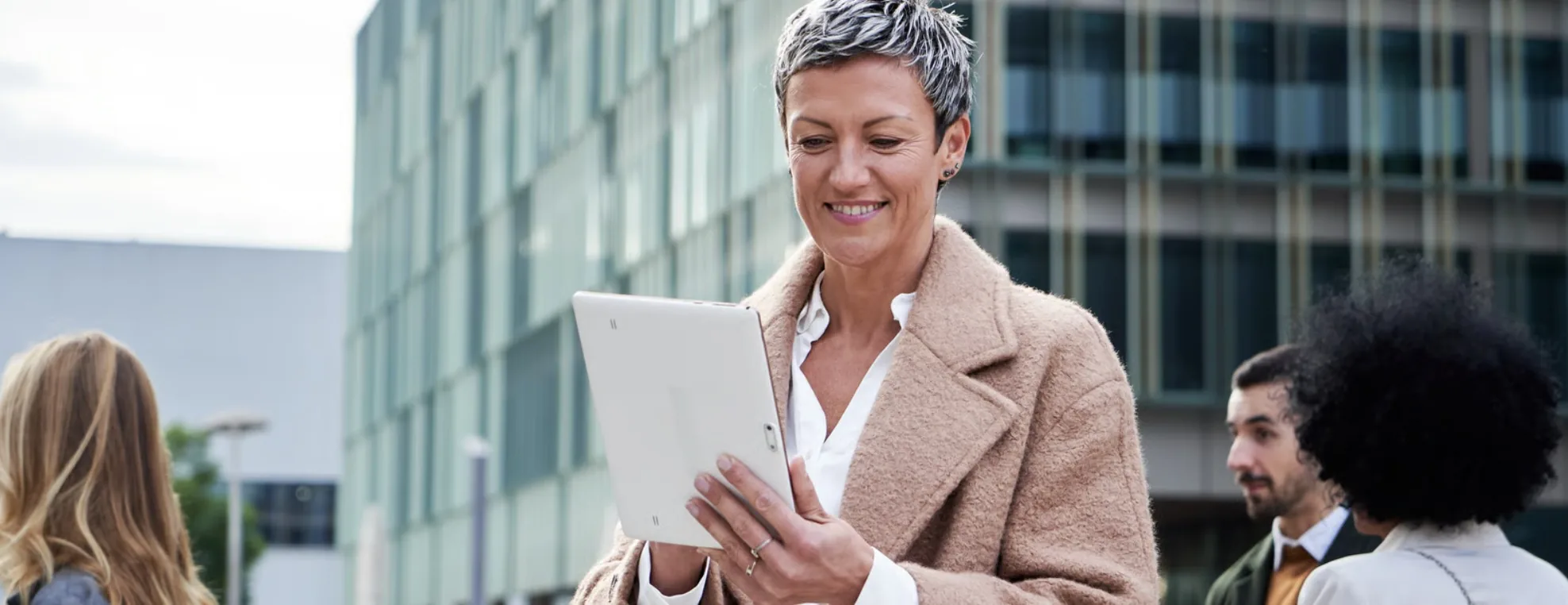 A professional reviewing details on a tablet