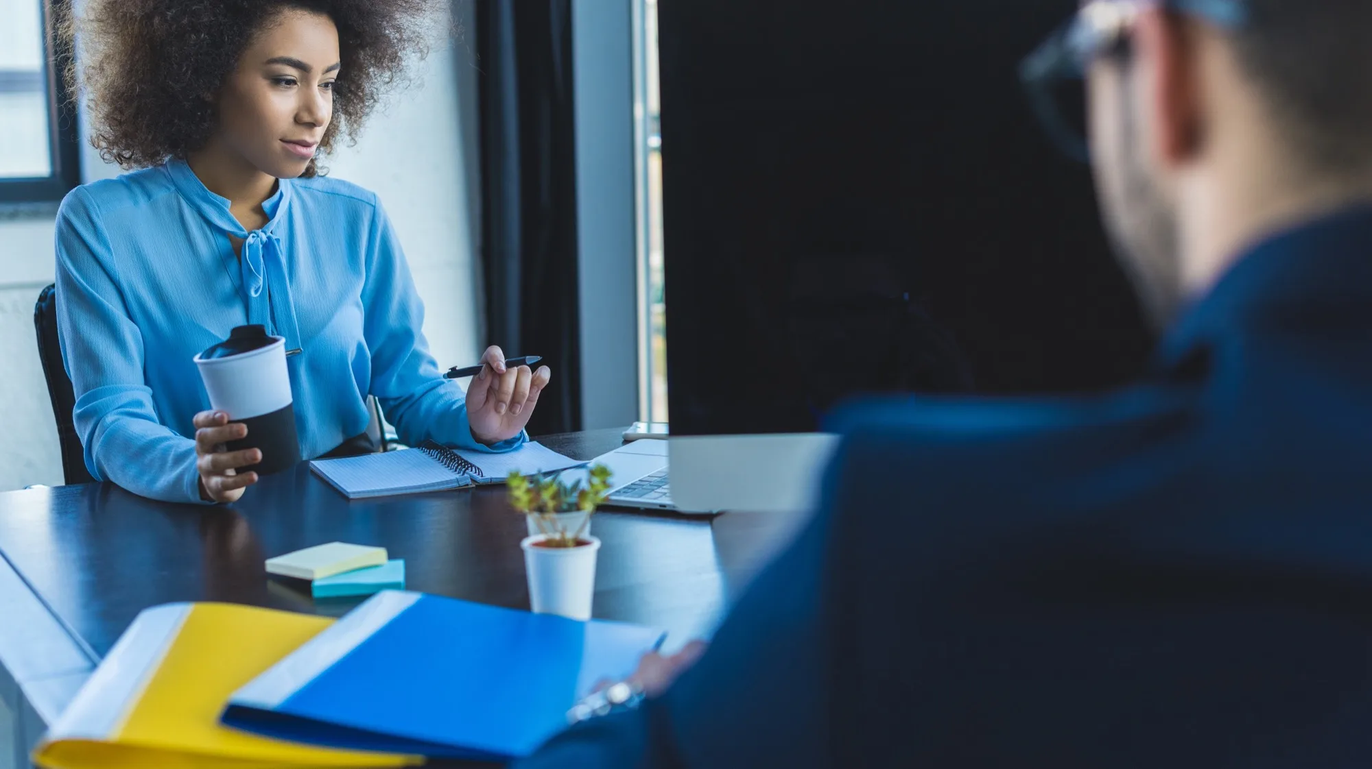 Business professionals reviewing documents together in a meeting